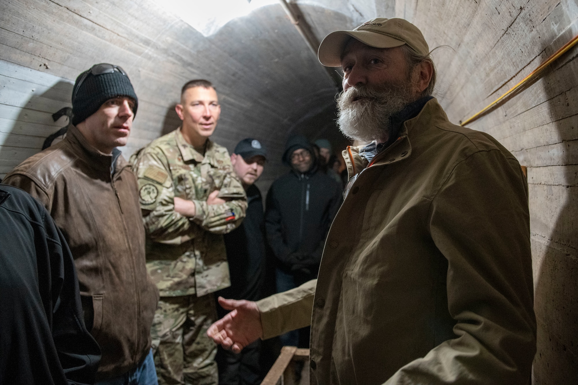 Airmen tour a dam.