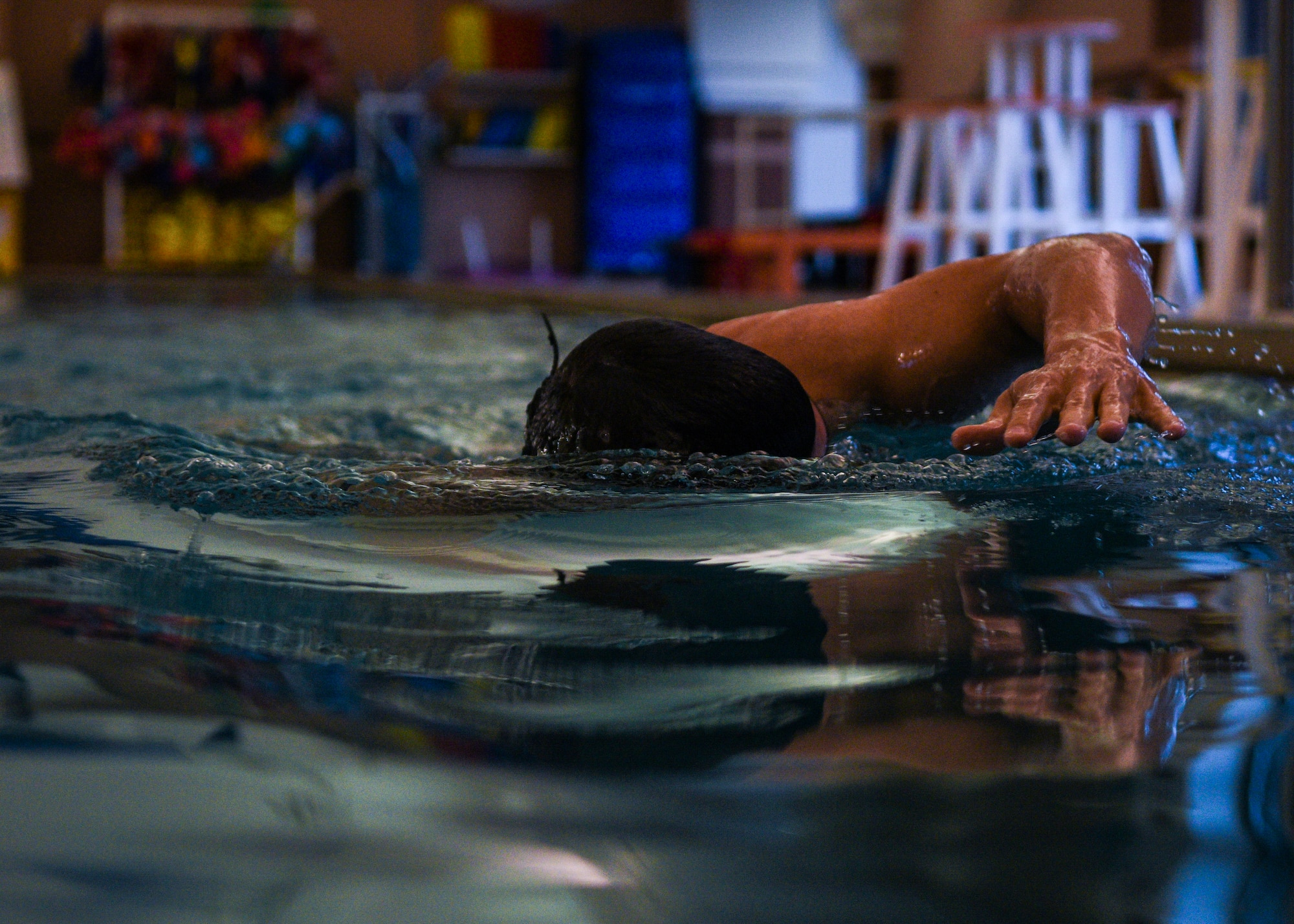 Major Richard Bottinelli, 90th Force Support Squadron operations officer, swims at the Aquatic Center pool at F.E. Warren Air Force Base, Wyo., July 17, 2019. Bottinelli trained for months to compete in a bodybuilding competition in Orlando, Fla. (U.S. Air Force photo by Staff Sgt. Ashley N. Sokolov)