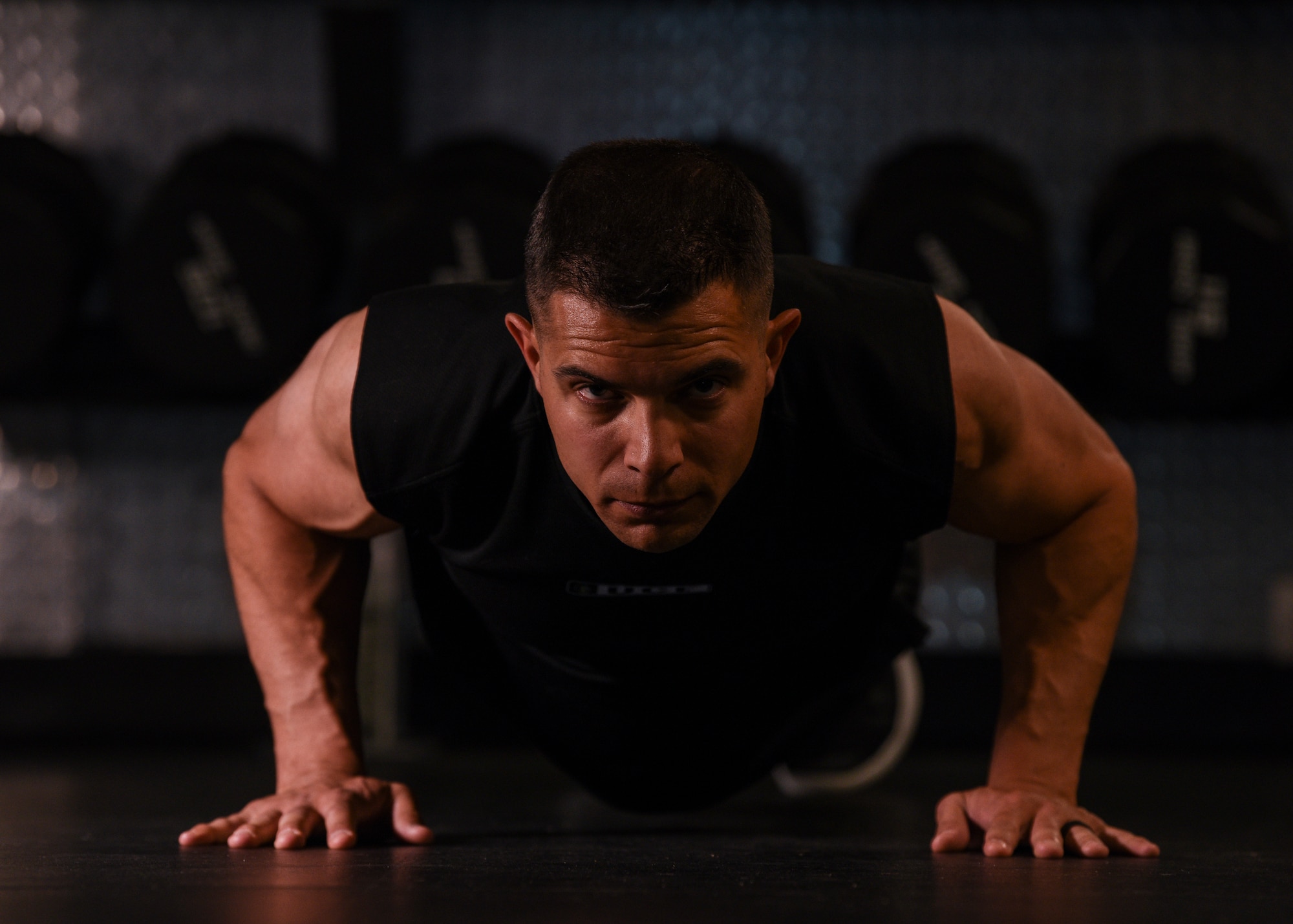 Major Richard Bottinelli, 90th Force Support Squadron operations officer, does a push-up at the Freedom Hall Fitness Center on F.E. Warren Air Force Base, Wyo., Aug. 1, 2019. He signed-up to compete in the men’s physique category in the Orlando, Fla., bodybuilding competition, a relatively new competing category, established in 2016. (U.S. Air Force photo by Staff Sgt. Ashley N. Sokolov)