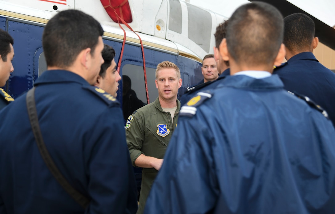 Capt. Nathan Bartlett, 1st Helicopter Squadron UH-1N pilot, briefs cadets from the Latin American Cadet Initiative about the UH-1N Iroquois during a tour on Joint Base Andrews, Md., Oct. 16, 2019.