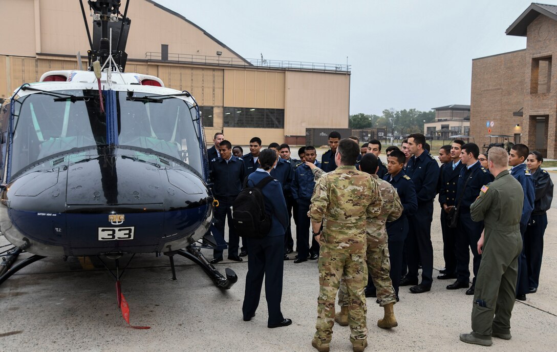 Cadets with the Latin American Cadet Initiative view a UH-1N Iroquois helicopter during a tour of the 1st Helicopter Squadron on Joint Base Andrews, Md., Oct. 16, 2019.