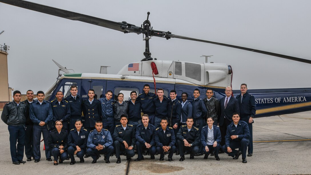 Members of the 1st Helicopter Squadron and cadets from the Latin American Cadet Initiative pose for a photo following a tour of the squadron on Joint Base Andrews, Md., Oct. 16, 2019.