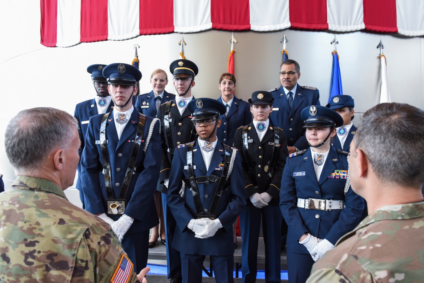 Lt. Gen. Robert Ashley Jr. (left), DIA director, and Chief Master Sgt. Benjamin “Jake” Higginbotham (right), the Agency’s command senior enlisted leader, speak with cadets of the Civil Air Patrol’s National Capital Wing at the conclusion of their performance, Oct. 10.