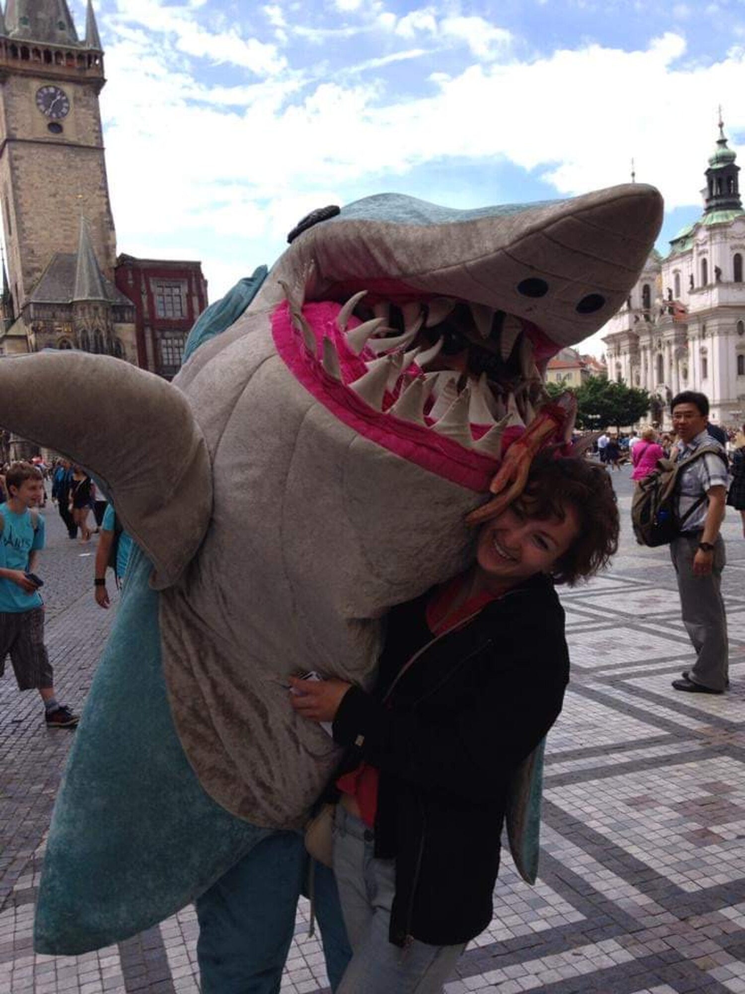 Traveler, Kaitlyn Brewer, stands with a shark in Copenhagen Denmark, 2014.