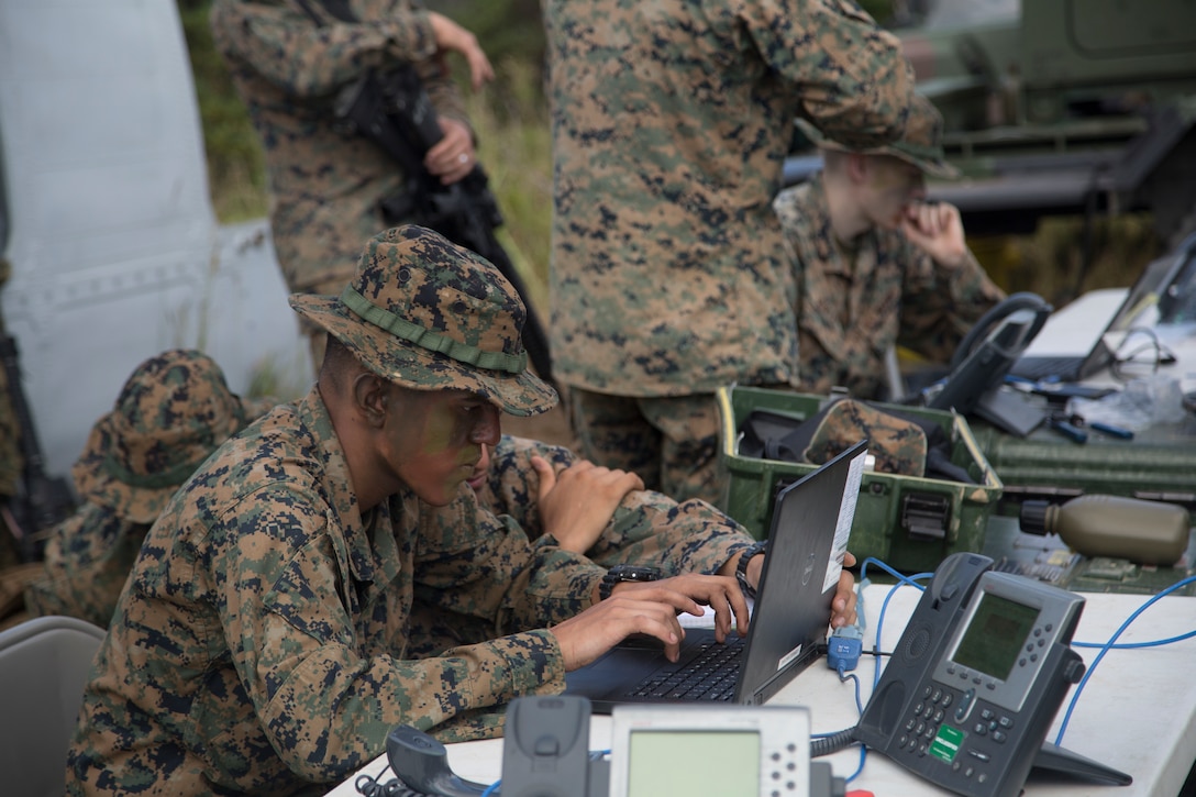 U.S. Marines compete against each other in a race to set up a working communication system during an exercise at the Jungle Warfare Training Center in Okinawa, Japan, Oct. 18, 2018. The race required the Marines to make their own cables, and then with the use of a computer, create a network to establish a connection between two phones. Alpha Company, 7th Communication Battalion conducted the communications exercise to test their capabilities in providing communication services in field environments as well as train in jungle warfare tactics.