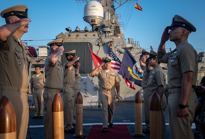 Chief Gas Turbine Systems Technician (Mechanical) Nester Contreras walks through side boys during a chief petty officer pinning ceremony aboard the Arleigh Burke-class guided-missile destroyer USS Porter at Naval Station Rota, Spain, Sept. 18, 2019. Porter, forward-deployed to Rota, Spain, is on its seventh patrol in the U.S. 6th Fleet area of operations in support of U.S. national security interests in Europe and Africa.