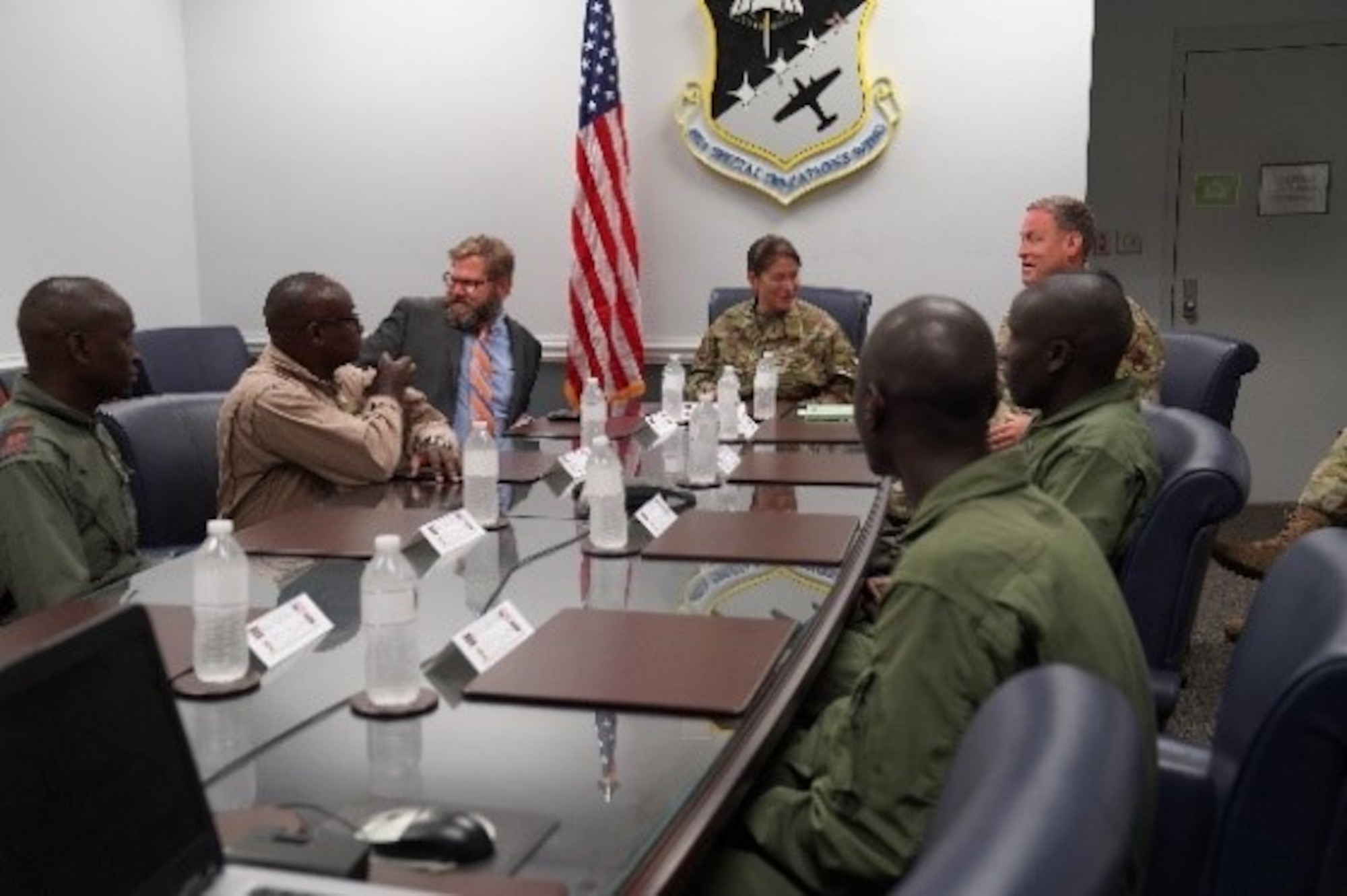 Brig. Gen. Brenda Cartier, Air Force Special Operations Command’s Director of Operations, top center, meets with Kenyan Air Force members and other U.S. military leaders attending the C-145 Skytruck aircraft training at Hurlburt Field, Florida, Sep. 17, 2019. (Courtesy Photo)