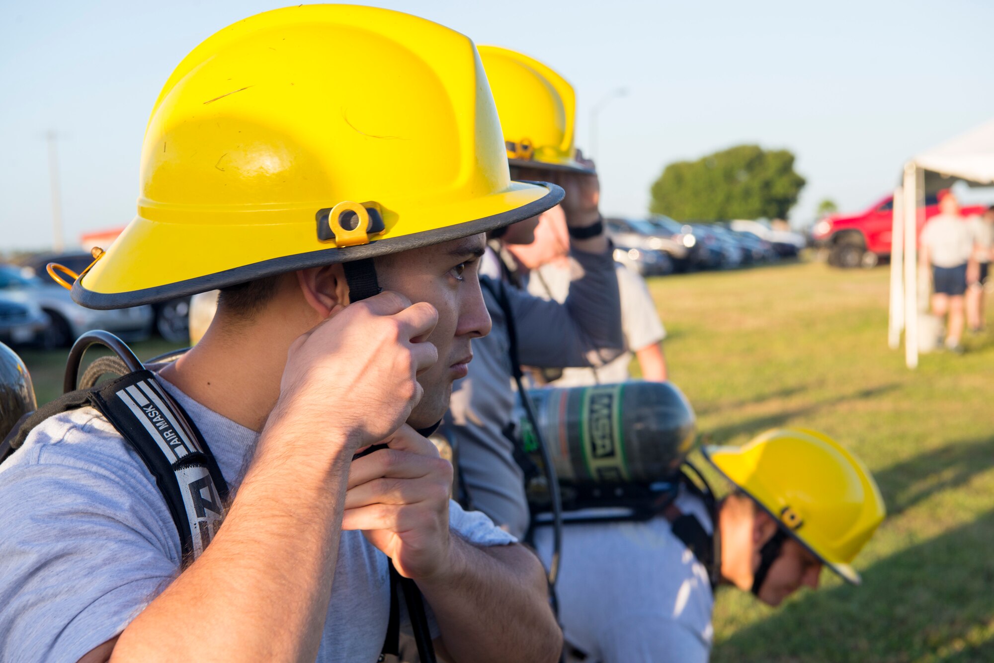 Airmen from the Aubert E. Dozier Airman Leadership School participate in a firefighter muster during Fire Prevention Week at MacDill Air Force Base, Fla., Oct. 11, 2019.