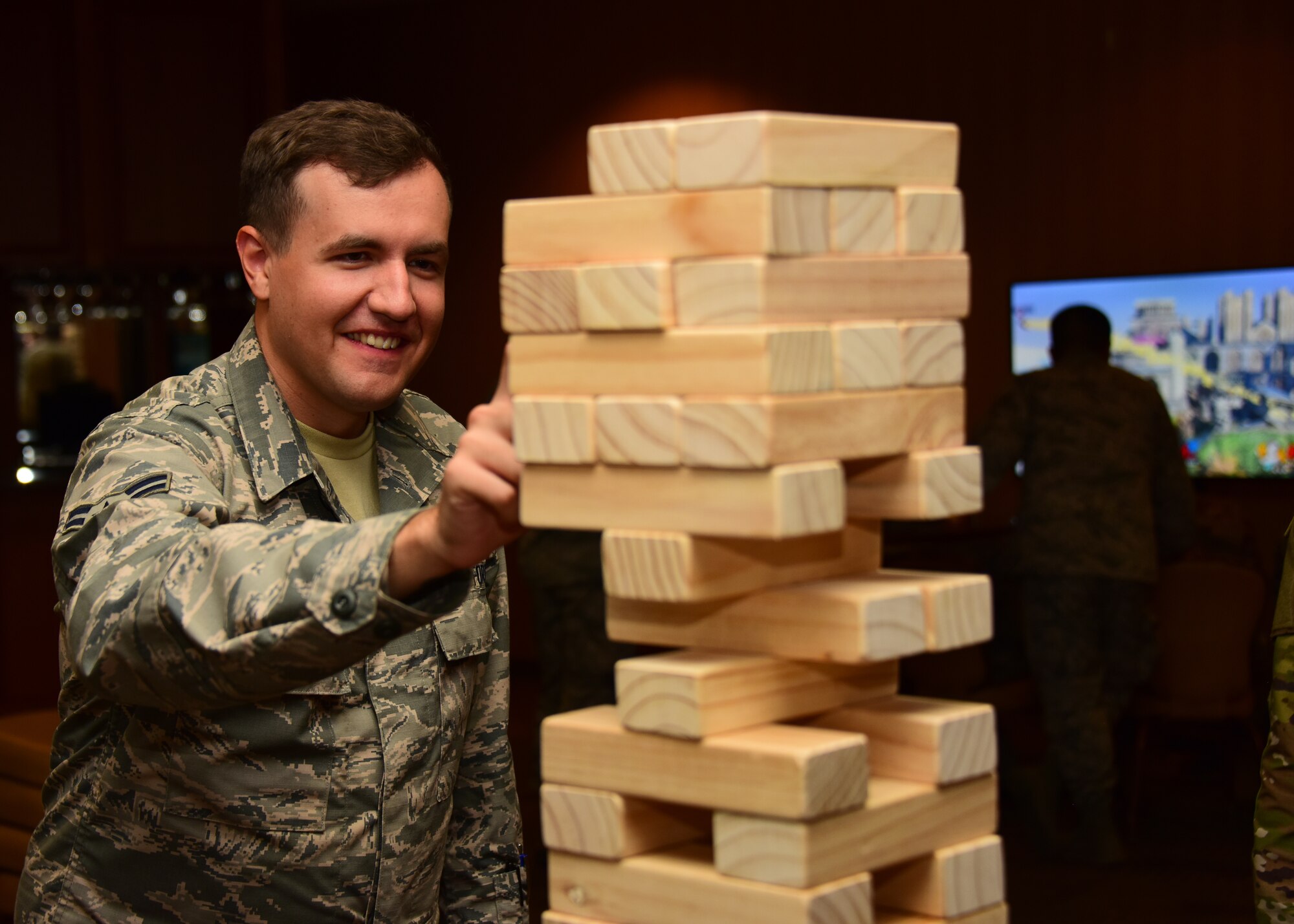 Airman plays Jenga