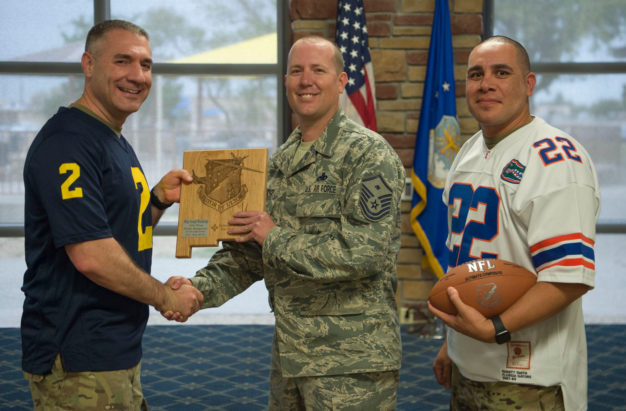 Master Sgt. Joseph Wooldridge, 49th Operations Group 3rd quarter award winner, accepts the First Sergeant of the Quarter award during the 49th Wing’s 3rd quarter award ceremony, Oct. 18, on Holloman Air Force Base, N.M. Quarterly award winners were selected based on their technical expertise, demonstration of leadership and job performance. (U.S. Air Force photo by Airman 1st Class Quion Lowe)