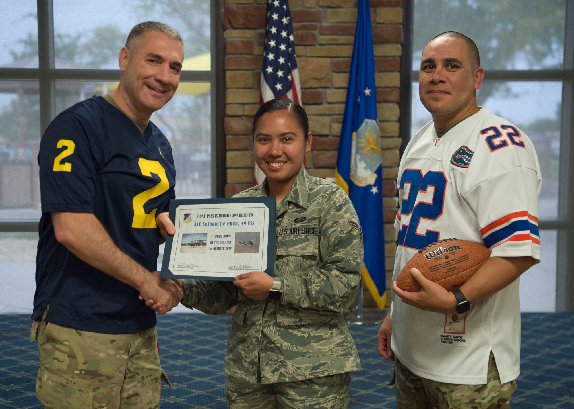 Airman 1st Class Anthonette Phua, 49th Mission Support Group member, accepts the 1st place Dorm Resident of the Quarter award during the 49th Wing’s 3rd quarter award ceremony, Oct. 18, on Holloman Air Force Base, N.M. Quarterly award winners were selected based on their technical expertise, demonstration of leadership and job performance. (U.S. Air Force photo by Airman 1st Class Quion Lowe)