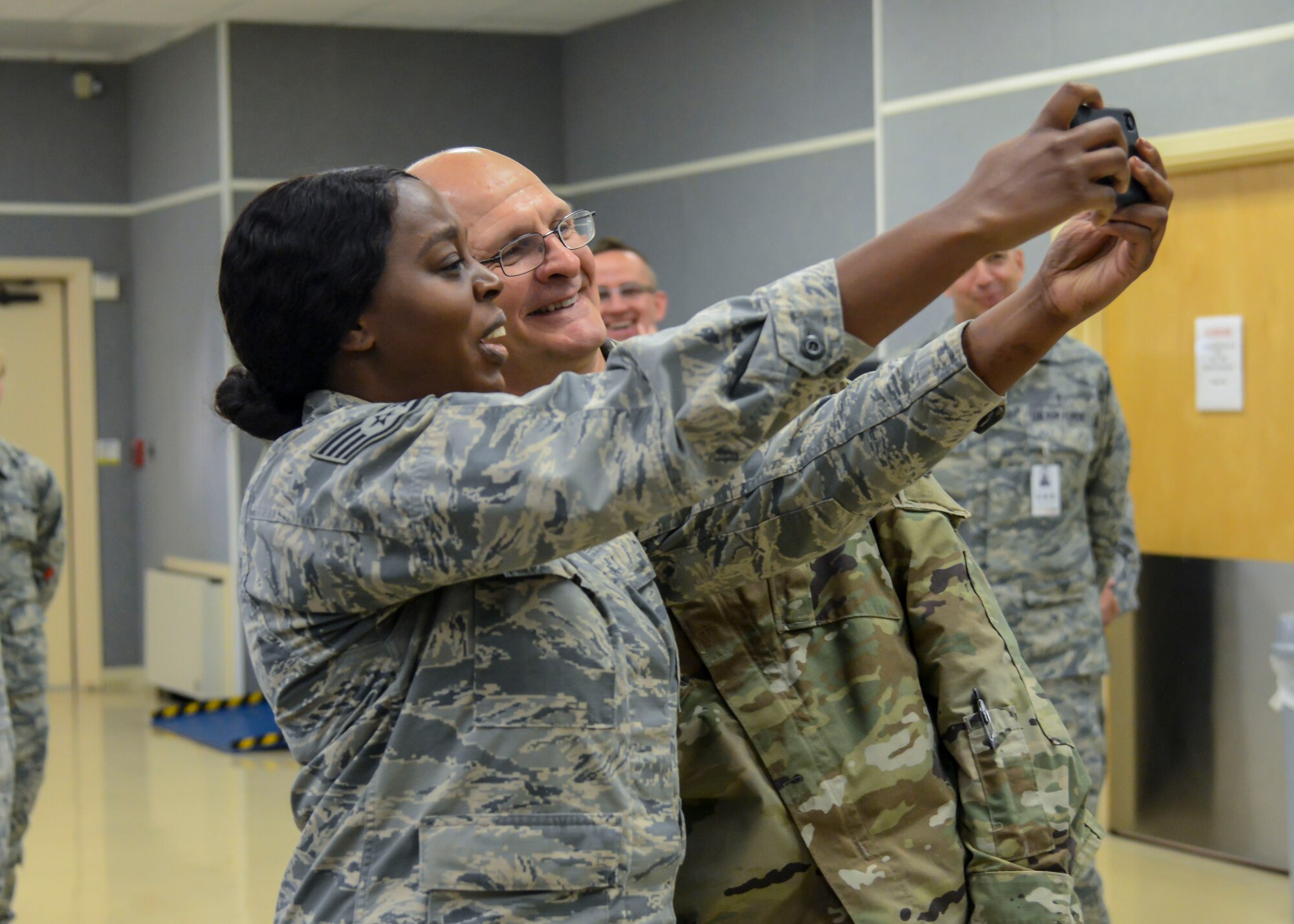 Staff Sgt. Ruth Elliot, 412th Medical Group, takes a “selfie” with Gen. Arnold Bunch, Commander, Air Force Materiel Command, at Edwards Air Force Base, California, Oct. 18. Elliot was a presented a commander’s coin by the AFMC commander. (U.S. Air Force photo by Giancarlo Casem)