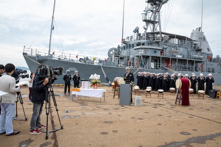 Commanding officer of Avenger-class mine countermeasures ship USS Pioneer (MCM 9), Lt. Cmdr. Bobby Wayland, gives opening remarks to the media and distinguished officials of Uki city, Japan.