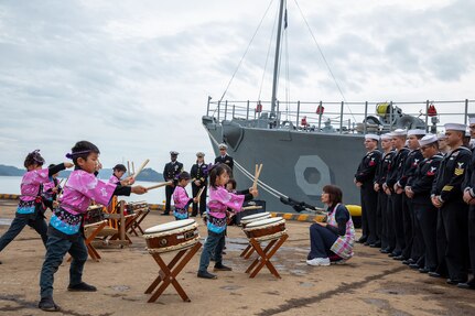 Local kindergarteners from Uki city give a musical performance on “Wadaiko,” a type of traditional Japanese drums for the crew of Avenger-class mine countermeasures ship USS Pioneer (MCM 9).