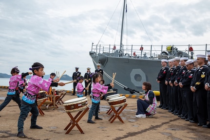 Local kindergarteners from Uki city give a musical performance on “Wadaiko,” a type of traditional Japanese drums for the crew of Avenger-class mine countermeasures ship USS Pioneer (MCM 9).