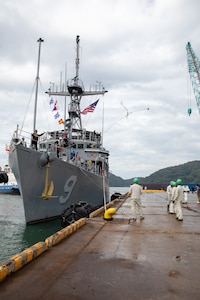 Avenger-class mine countermeasures ship USS Pioneer (MCM 9) moors port side in Uki city port.
