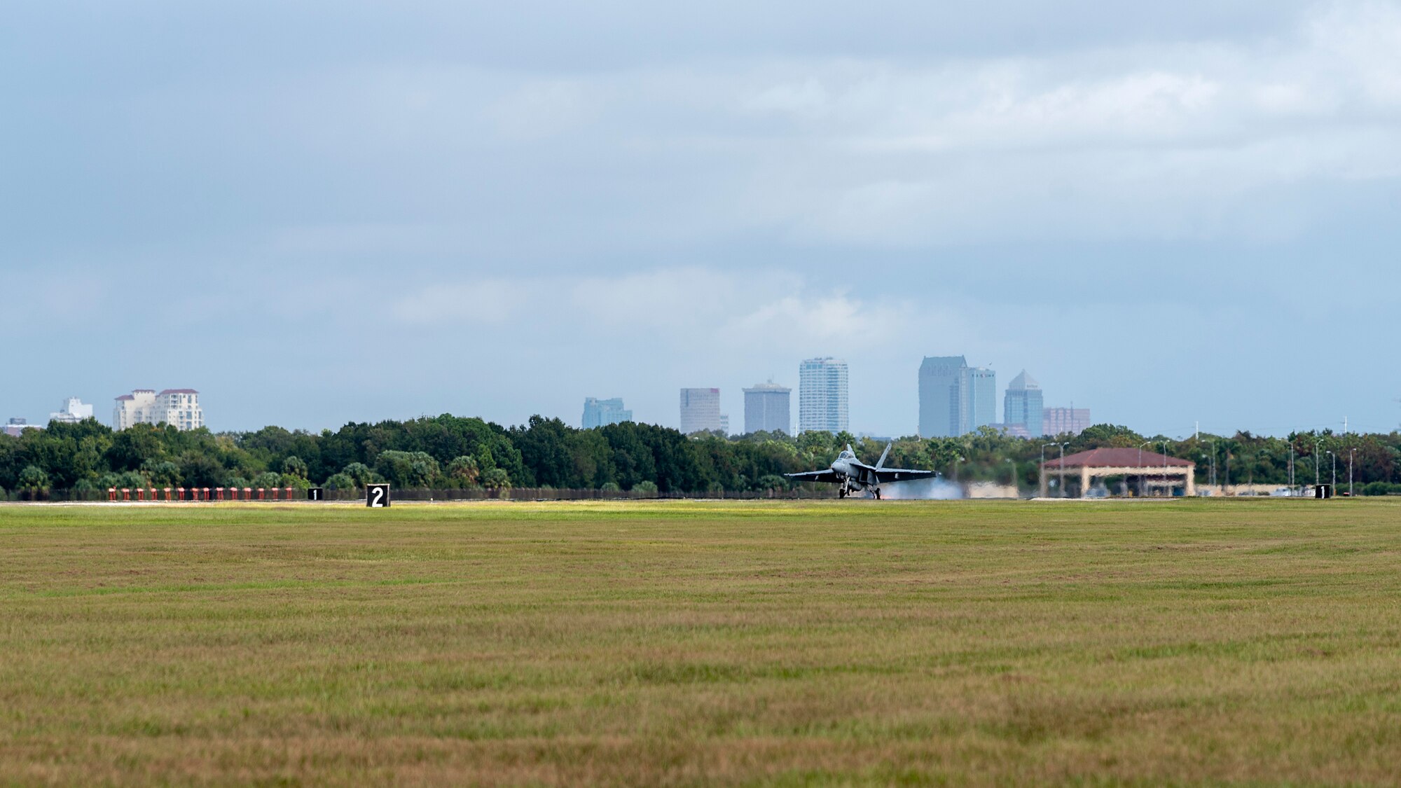 A U.S. Navy Strike Fighter Squadron 106 F/A-18F Super Hornet aircraft from Naval Air Station Oceana, Va., performs an arrested landing at MacDill Air Force Base, Fla., Oct 16, 2019. Arrested landings allow pilots to achieve rapid deceleration when landing aboard an aircraft carrier. They are performed by lowering the arresting hook until it engages an arresting cable, which is stretched across the landing area and absorbs the energy of the aircraft once engaged.
