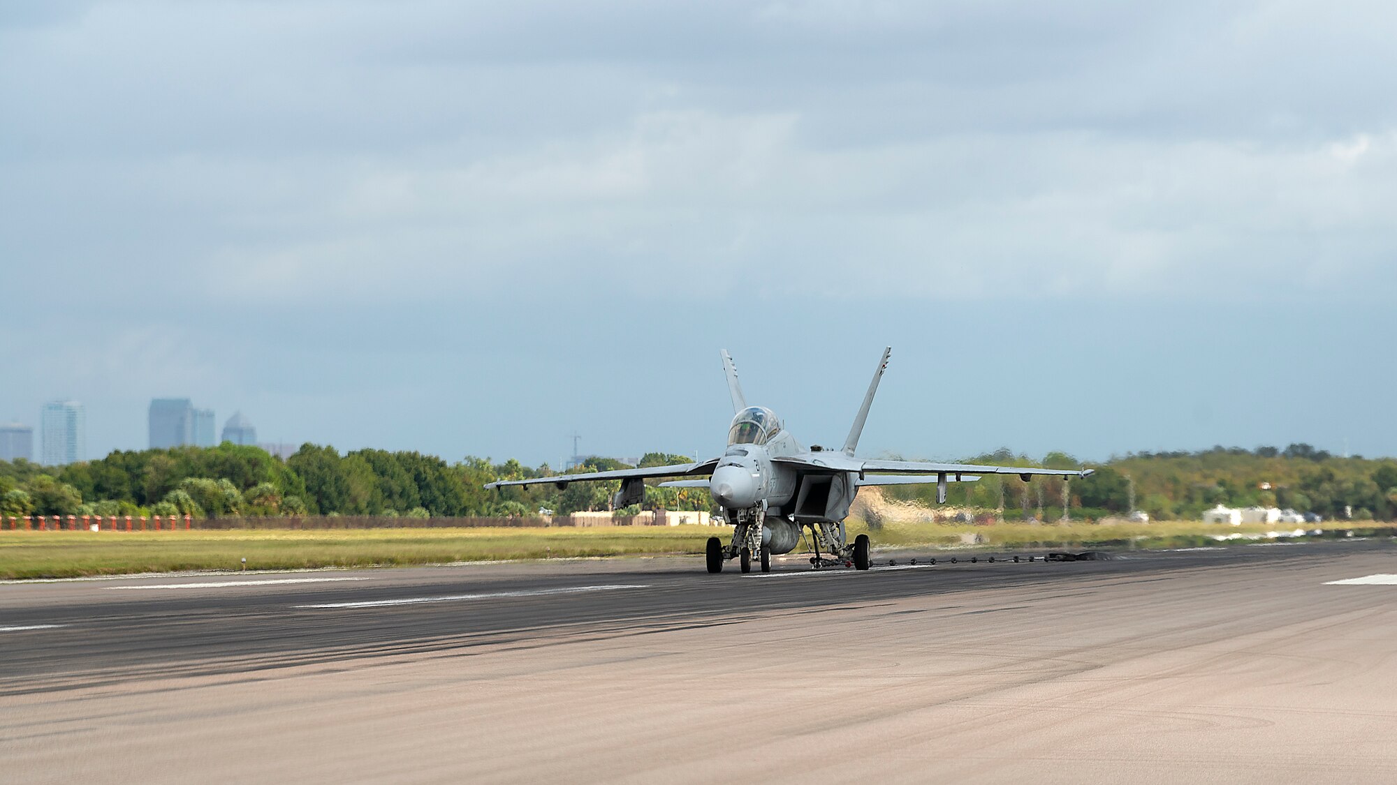 A U.S. Navy Strike Fighter Squadron 106 F/A-18F Super Hornet aircraft from Naval Air Station Oceana, Va., performs an arrested landing at MacDill Air Force Base, Fla., Oct 16, 2019. Arrested landings allow pilots to achieve rapid deceleration when landing aboard an aircraft carrier. They are performed by lowering the arresting hook until it engages an arresting cable, which is stretched across the landing area and absorbs the energy of the aircraft once engaged.