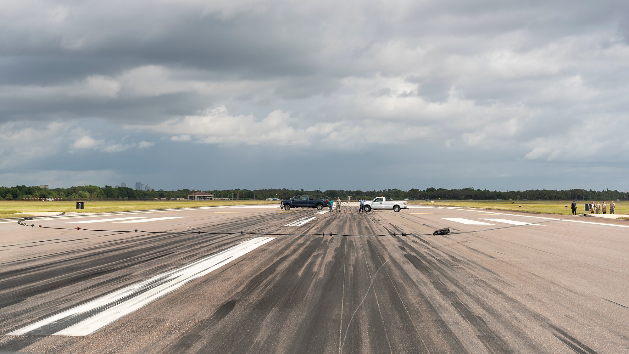 MacDill Airmen retract an arresting cable used by a U.S. Navy Strike Fighter Squadron 106 F/A-18F Super Hornet aircraft to perform an arrested landing at MacDill Air Force Base, Fla., Oct 16, 2019. Arrested landings allow pilots to achieve rapid deceleration when landing aboard an aircraft carrier by attaching a tailhook to a cable, which absorbs the energy of the aircraft.