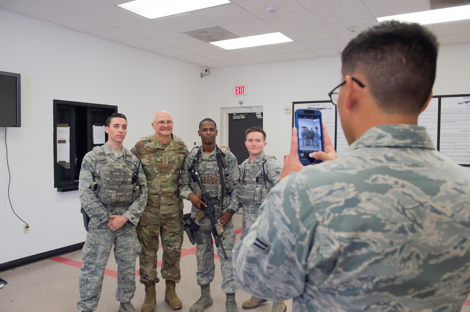 Defenders from 412th Security Forces Squadron pose for a photo with Gen. Arnold Bunch, Commander, Air Force Materiel Command during his visit to Edwards Air Force Base, California, Oct. 18. (U.S. Air Force photo by Richard Gonzales)