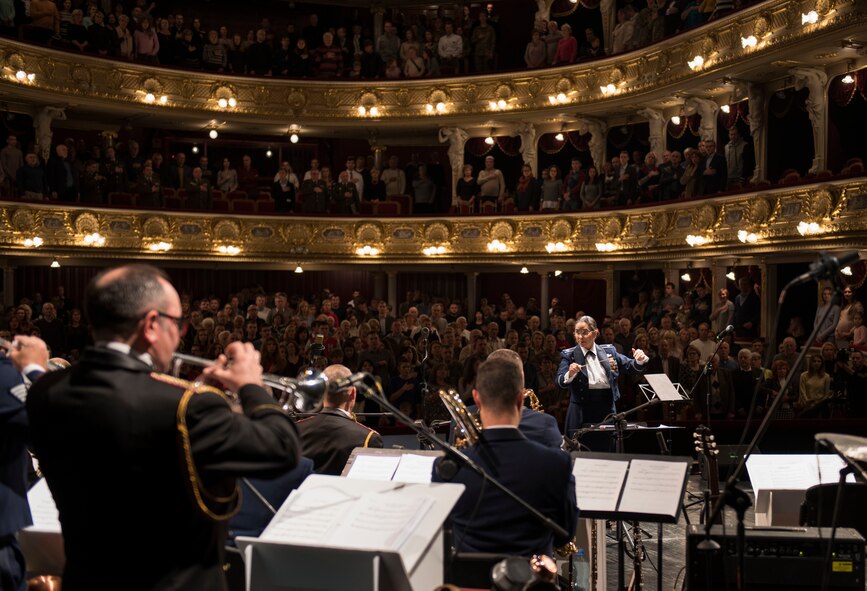 U.S. Air Forces in Europe Ambassadors Jazz Band commander and conductor, directs a concert with the USAFE Band