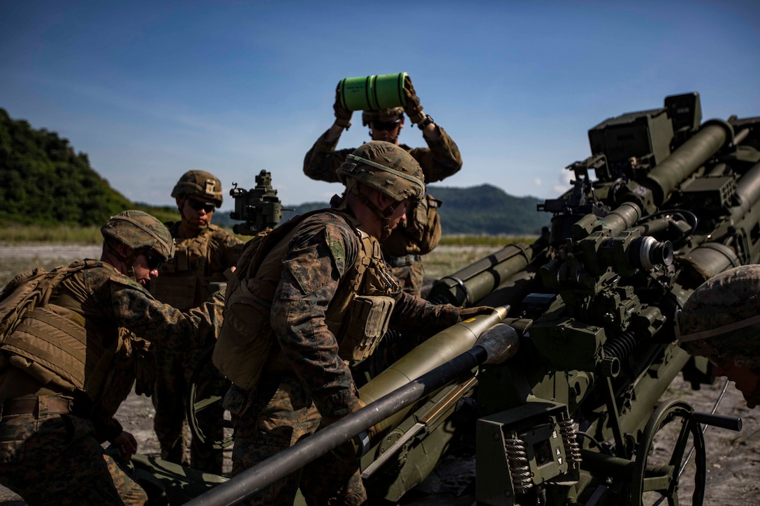 U.S. Marines with Alpha Battery, Battalion Landing Team, 3rd Battalion, 5th Marine Regiment, 11th Marine Expeditionary Unit, prepare to fire an M777 Howitzer during exercise KAMANDAG 3 at Colonel Ernesto P. Ravina Air Base, Philippines, Oct. 13, 2019. KAMANDAG helps participating forces maintain a high level of readiness and responsiveness, and enhances combined military-to-military relations, interoperability, and multinational coordination. KAMANDAG is an acronym for the Filipino phrase “Kaagapay Ng Mga Manirigma Ng Dagat,” which translates to “Cooperation of the Warriors of the Sea,” highlighting the partnership between the U.S. and Philippine militaries.