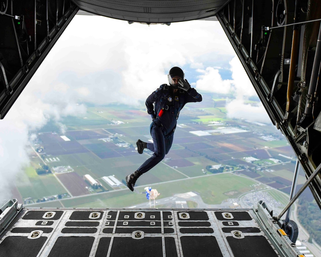 Olivia Gillingham, Air Force Academy cadet and member of the Wings of Blue Parachute Team, waves goodbye as she jumps out of a C-130H over the annual Sky’s No Limit – Girls Fly Too event in Abbottsford, British Columbia, Canada. She is part of the all-female cadet parachute team supporting the annual event that promotes gender diversity in aviation.