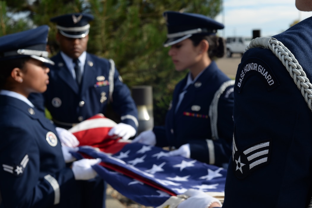 Malmstrom honor guardsmen perform a flag-folding ceremony Sept. 21, 2018, at Malmstrom Air Force Base, Mont. The National Defense Authorization Act of 2019 altered the Transition Assistance Program to allow military members to take advantage of its benefits 12-15 months before retirement or separation, compared to the previous 89 days. (U.S. Air Force photo by Airman 1st Class Tristan Truesdell)