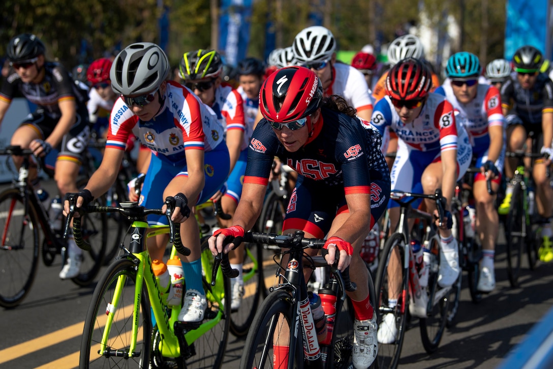 A group of women cyclists pedal toward the camera.