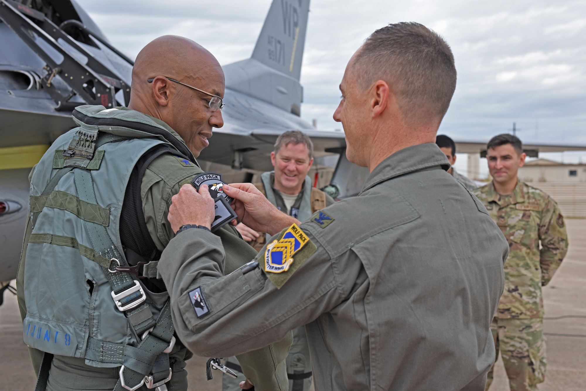 U.S. Air Force Gen. CQ Brown, Jr. Pacific Air Forces commander, receives a Wolf Pack patch from Col. Tad Clark, 8th Fighter Wing commander, during a visit at Kunsan Air Base, Republic of Korea, Oct. 18, 2019. Brown was stationed at Kunsan from April 1987 to October 1988 as a first lieutenant and then again from May 2007 to May 2008, where he led the Wolf Pack as “Wolf 46.” (U.S. Air Force photo by Staff Sgt. Mackenzie Mendez)