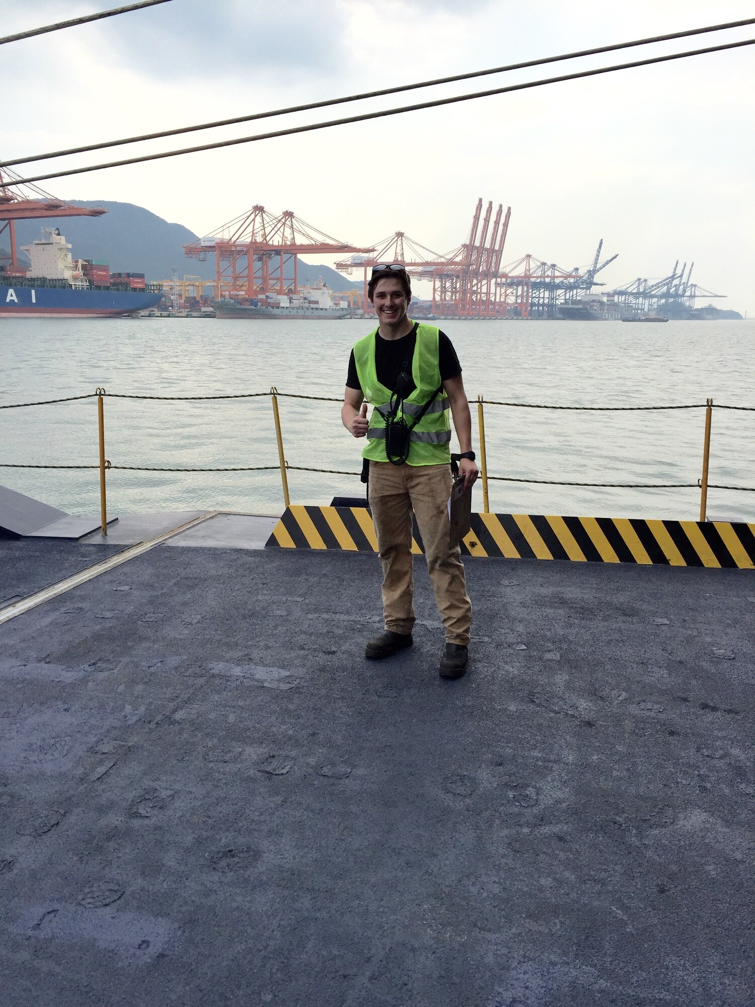 2nd Lt. Chad Cleary, then a U.S. Merchant Marine Academy cadet, working cargo operations in Ulsan, South Korea. Part of the job was to make sure outgoing Army/Air Force cargo was correct in getting off at that port and ensuring incoming cargo was secured correctly and in the right location. Photo taken on M/V Liberty Promise.
