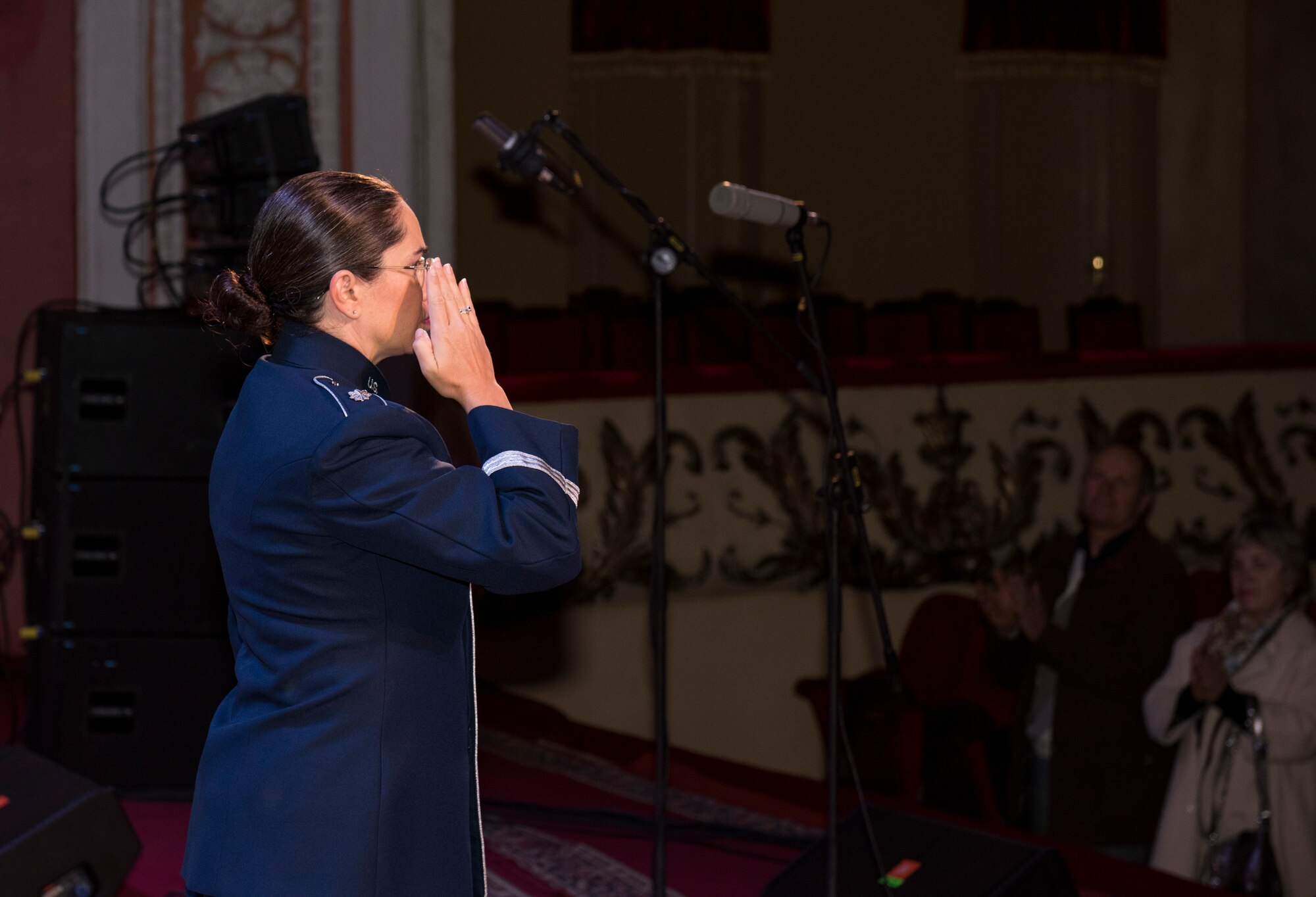 U.S. Air Force Lt. Col Cristina Moore Urrutia, U.S. Air Forces in Europe Ambassadors Jazz Band commander and conductor, salutes the citizens of Vinnytsia during a concert with the USAFE Band and the Ukrainian National Presidential Orchestra at the Music and Drama Theater in Vinnytsia, Ukraine, October 14, 2019. The USAFE Band traveled to six cities in central and western Ukraine October 6-20, 2019 to conduct the “Music of Freedom” tour, which celebrated the shared spirit of freedom and enduring partnership between U.S. and Ukrainian armed forces. (U.S. Air Force photo by Airman 1st Class Jennifer Zima)