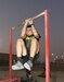 Sgt. Jordan Guimont, 284th Engineer Company, performs a leg tuck repetition during the Army Combat Fitness Test (ACFT) training at Camp Arifjan, Kuwait, Oct. 16, 2019. Guimont is one of the 225 Soldiers that Sgt. 1st Class John Santos has trained to administer the ACFT since June, 2019.