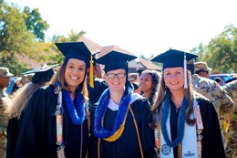 1st Sgt. Tammy Belcher, 1st Sgt., Headquarters and Headquarters Company, 1st Special Troops Battalion, 1st Theater Sustainment Command, Sgt. Adina Rivera, 1st Theater Sustainment Command, Sgt. 1st Class Kerrilee Case, 1st Theater Sustainment Command pose together following a Fort Knox Army Education Center College Graduation Ceremony at Waybur Theater, Oct, 17, 2019 on Fort Knox, Ky.