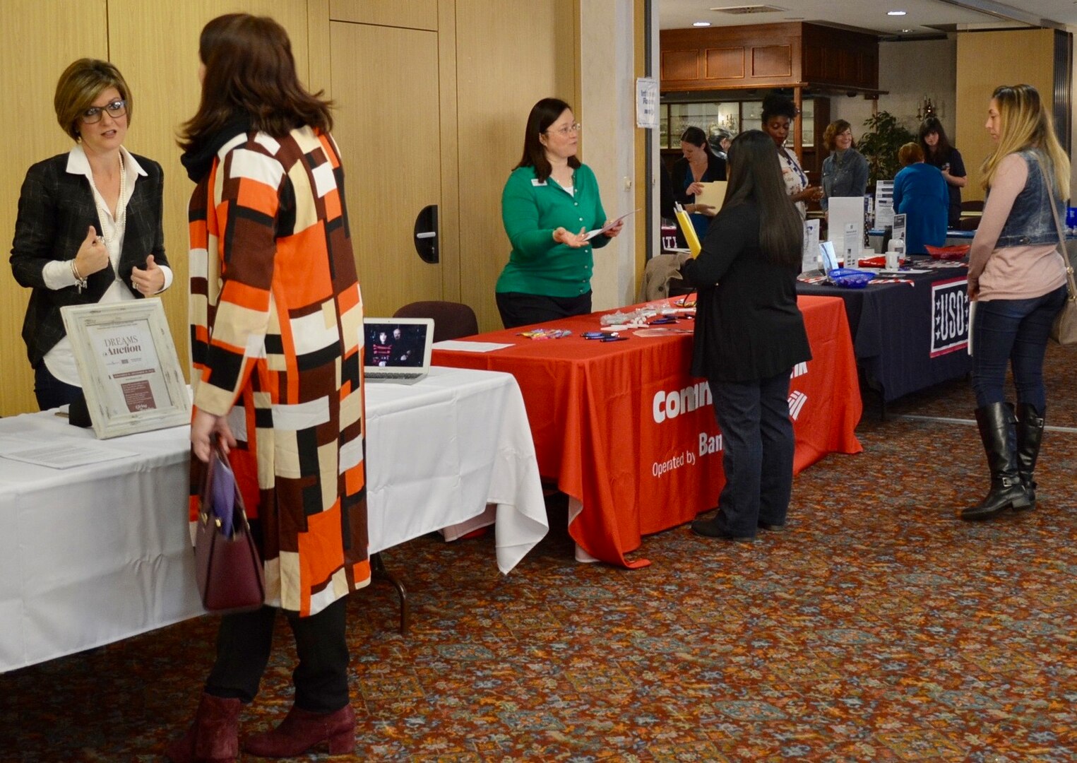 Spouses network with potential employers during a career fair hosted by U.S. Army Garrison Bavaria Army Community Service.