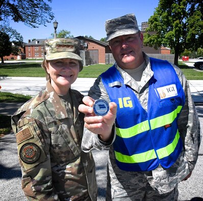 Gen. Maryanne Miller, the commander of Air Mobility Command at Scott Air Force Base, Ill., made a special coin presentation to Senior Master Sgt. Todd Wadkins at the 932nd Airlift Wing for his consistent hard work and assistance during a recent full spectrum readiness inspection held September 19, 2019.  The men and women of AMC, consisting of active duty, Air National Guard, Air Force Reserve and civilians, provide airlift, aerial refueling, special air mission, aeromedical evacuation and mobility support. Wadkins worked recently with maintenance and formerly served as the 932nd Airlift Wing's Ground Safety Manager, and is retiring after 30 years of military service to America.