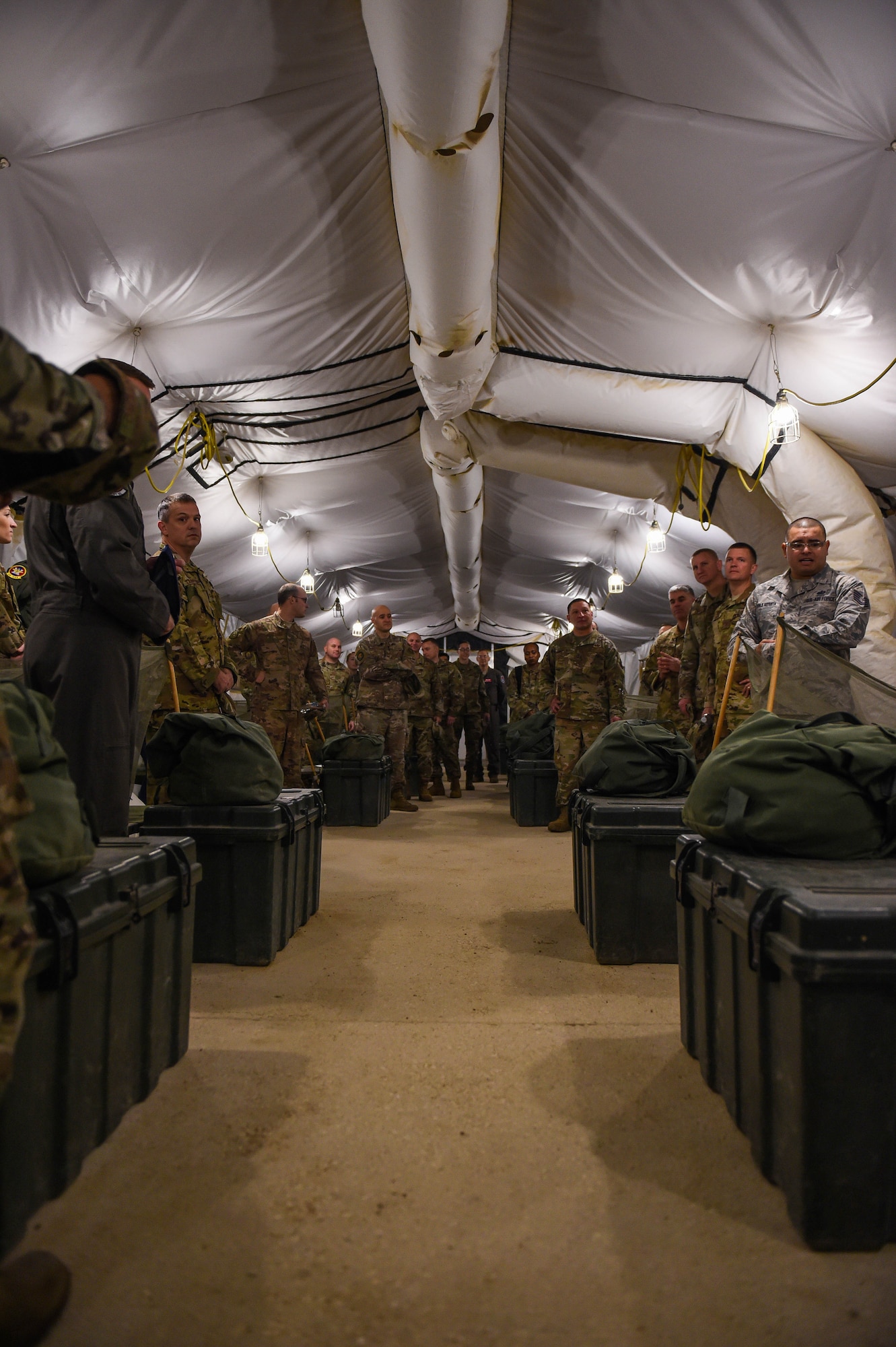 Leadership members from the 62nd Airlift Wing, Joint Base Lewis-McChord, Wash., look around a tent at the 319th Training Squadron, basic expeditionary Airman skills training (BEAST) headquarters, Lackland Air Force Base, Texas, Oct. 17, 2019. U.S. Air Force basic trainees spend one out of the eight weeks of basic military training (BMT) at BEAST, where they fulfill about 80 percent of their BMT graduation requirements.