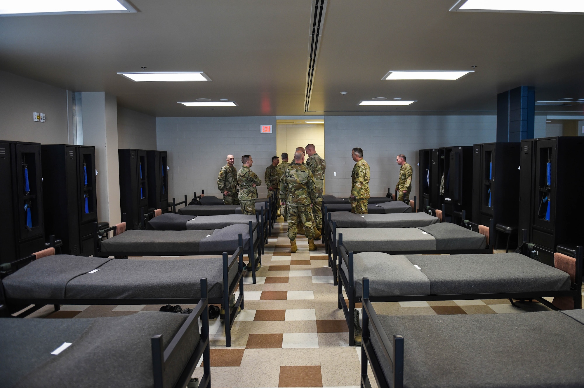 Leadership members from the 62nd Airlift Wing, Joint Base Lewis-McChord (JBLM), Wash., look around a basic military training dormitory in the 321st Training Squadron (321 TRS) at Lackland Air Force Base, Texas, Oct. 17, 2019. U.S. Air Force basic military trainees are required to meet specific requirements in the presentation of their wall lockers and dormitory.