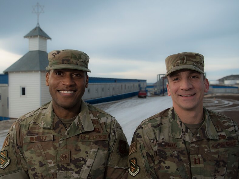 Staff Sgt. Steven Whitley, 821st ABG noncommissioned officer in charge of chapel operations, left, and Capt. Matthew Gallo, 821st Air Base Group installation chaplain stand in front of the chapel at Thule Air Base, Greenland, Oct. 10, 2019. The 821st ABG Chaplain Corps has stood on the forefront of innovation, being the first chapel in Air Force Space Command to adopt the new white rope program and starting the Faces of Space video series. (U.S. Air Force photo by Airman 1st Class Jonathan Whitely)