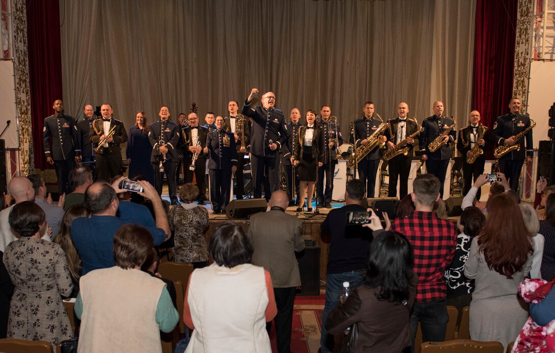 Musicians from the U.S. Air Forces in Europe Ambassadors Jazz Band and the Ukrainian National Presidential Orchestra join the audience in shouting, “Slava Ukrayini!” (“Glory to Ukraine!”), a common Ukrainian expression, at the end of a concert at the Philharmonic in Chernivisti, Ukraine, Oct. 12, 2019. The USAFE Band traveled to six cities in central and western Ukraine October 6-20, 2019 to conduct the “Music of Freedom” tour, which celebrated the shared spirit of freedom and enduring partnership between U.S. and Ukrainian armed forces. (U.S. Air Force photo by Airman 1st Class Jennifer Zima)