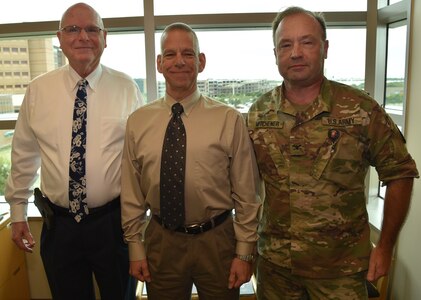 (From left) Dr. John Simecek, Naval Medical Research Unit San Antonio director of craniofacial health and restorative medicine; Dr. Sylvain Cardin, Naval Medical Research Unit San Antonio chief science director; and Col. Tim Mitchener, U.S. Army Institute of Surgical Research public health dentist and oral maxillofacial injury epidemiologist, collaborated on a six-page research paper published in the July/August issue of Military Medicine. Their research paper reviewed and analyzed data from 30 previous studies, both published and unpublished, covering reported dental emergencies and oral- and cranio-maxillofacial injuries of U.S. military personnel serving in combat environments, who were deployed, serving in stabilization operations and training exercises and those in garrison.