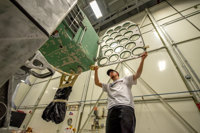 A student trainee, performs masking operations at Tobyhanna Army Depot.