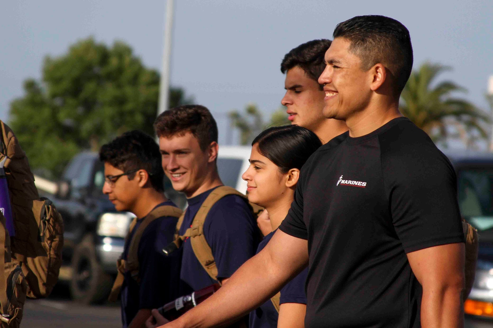 U.S. Marine Corps Staff Sgt. Francisco Partida, a canvassing recruiter with Recruting Sub-Station El Cajon, hikes alongside his poolees at Camp Pendleton, Calif., May 17, 2019. The 'Spartan Night' helps prepare poolees for what to expect while in boot camp and build comradery. (U.S. Marine Corps photo by Sgt. Bernadette Plouffe)