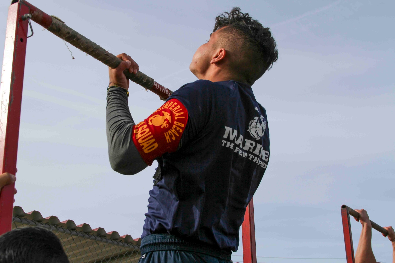 A U.S. Marine Corps poolee from Recruiting Station San Diego conducts pull-ups during the 'Spartan Night' at Camp Pendleton, Calif., May 17, 2019. The 'Spartan Night' helps prepare poolees for what to expect while in boot camp and build comradery.