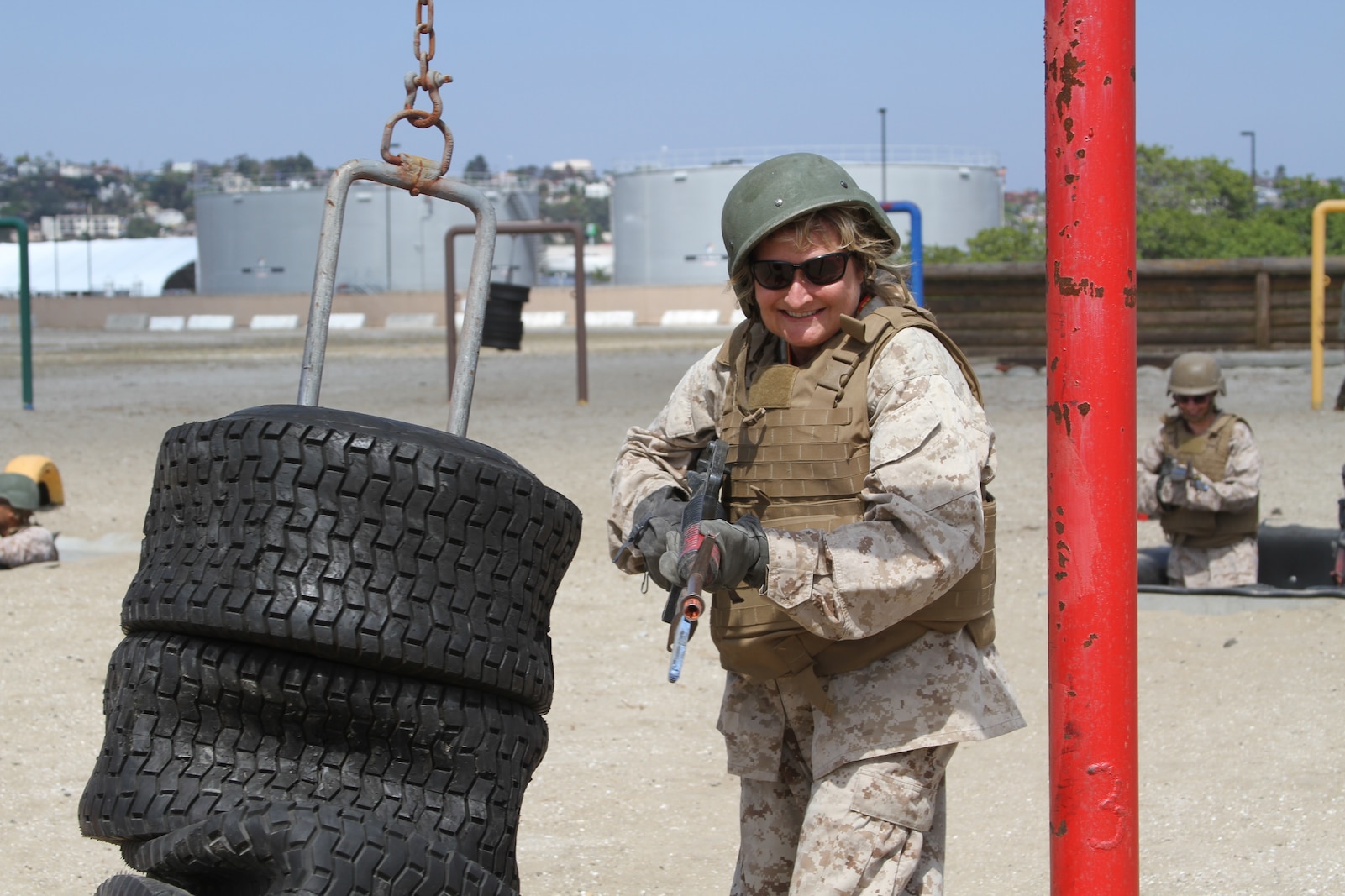 An educator from the San Diego area strikes a dummy on the bayonet assault course during the Educators' Workshop at Marine Corps Recruit Depot San Diego, June 17, 2019. The Educators' Workshop provides and in-depth experience about the transformation young men and women go through on their journey to claim the title Marine. (U.S. Marine Corps photo by Sgt. Bernadette Plouffe)