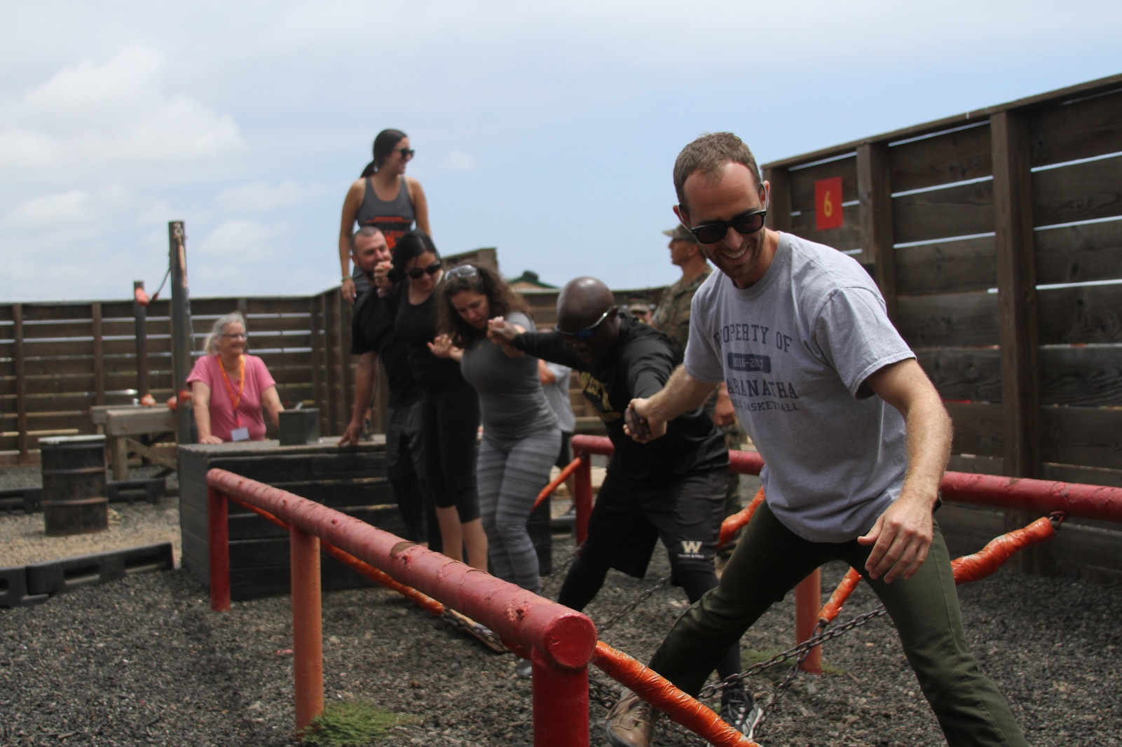 Educators from the San Diego area maneuver through the Leadership Reaction Course during the Educators' Workshop at Camp Pendleton, June 17, 2019. The Educators' Workshop provides and in-depth experience about the transformation young men and women go through on their journey to claim the title Marine. (U.S. Marine Corps photo by Sgt. Bernadette Plouffe)