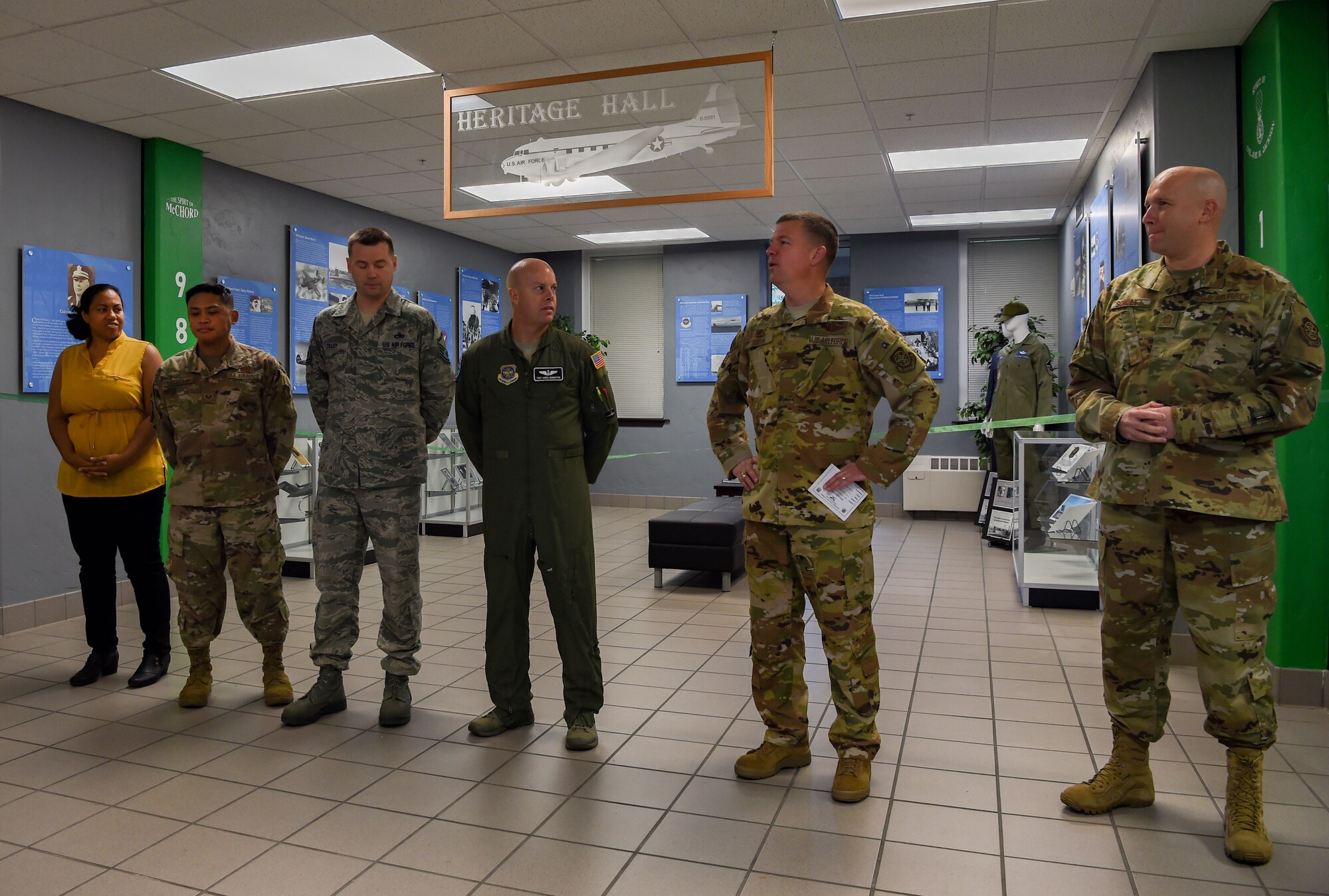 Col. Scovill Currin, 62nd Airlift Wing commander, recognizes a team of McChord Airmen and civilians who worked to update the Heritage Hall in the wing headquarters building at Joint Base Lewis-McChord, Wash., Oct. 21, 2019. The new heritage hall features photos and information highlighting McChord’s involvement in historical operations while also showcasing what the men and women serving today are doing to complete the Air Force mission. (U.S. Air Force photo by Senior Airman Tryphena Mayhugh)