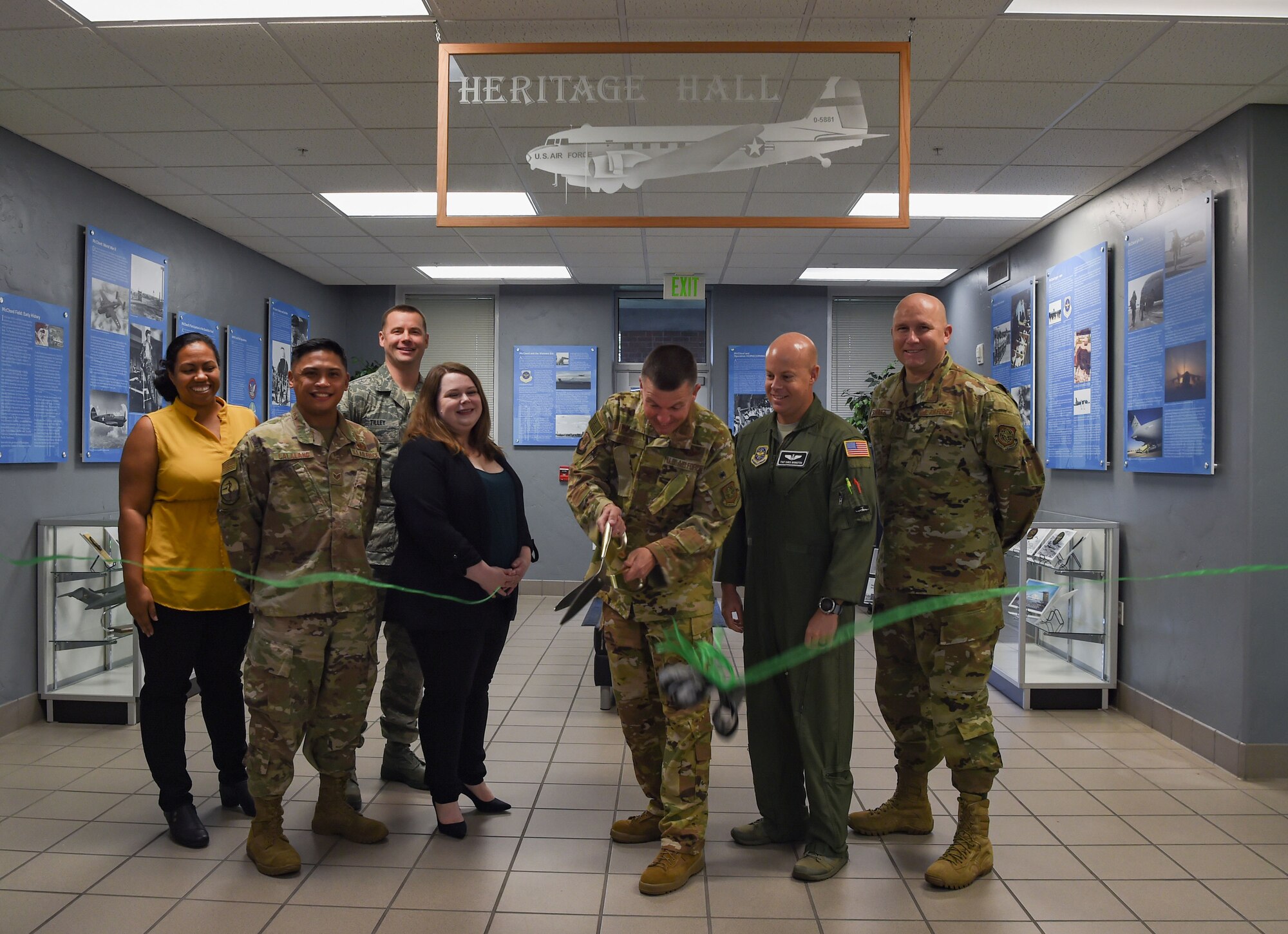 Col. Scovill Currin, 62nd Airlift Wing commander, cuts a ribbon marking the completion of the wing headquarter building’s Heritage Hall at Joint Base Lewis-McChord, Wash., Oct. 21, 2019. The new hall highlights Team McChord’s heritage and honors the men and women who have and are serving at McChord Field. (U.S. Air Force photo by Senior Airman Tryphena Mayhugh)