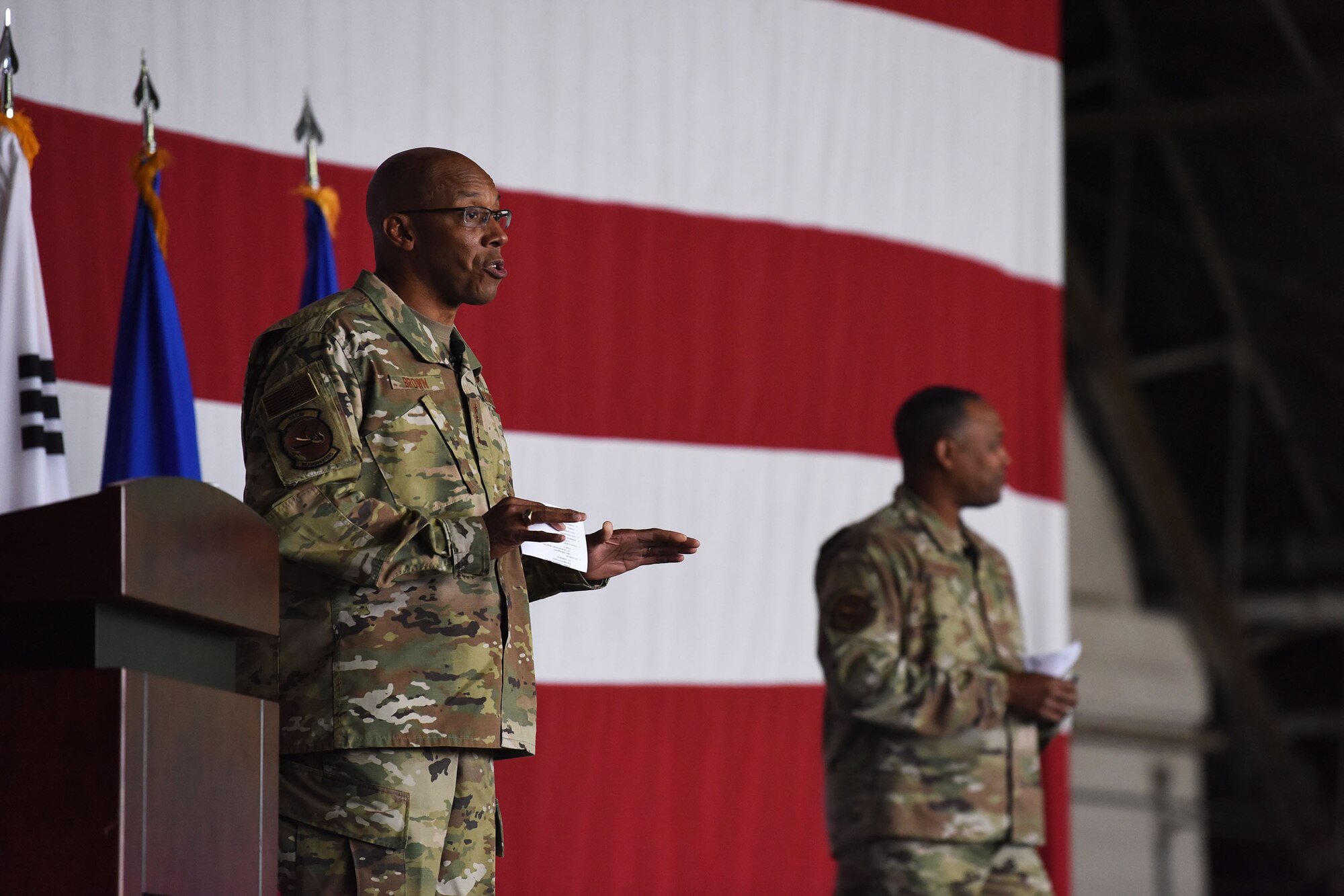 Gen. CQ Brown, Jr., Pacific Air Forces commander, and Chief Master Sgt. Anthony Johnson, PACAF command chief, brief the men and women of Team Osan during an all-call at Osan Air Base, Republic of Korea, Oct. 17, 2019. While gaining an in-depth exposure of the installation’s unique mission, PACAF leadership used the visit as an opportunity to explain PACAF priorities and how vital Team Osan is in contributing to the Indo-Pacific region’s security and stability. (U.S. Air Force photo by Staff Sgt. Benjamin Bugenig)