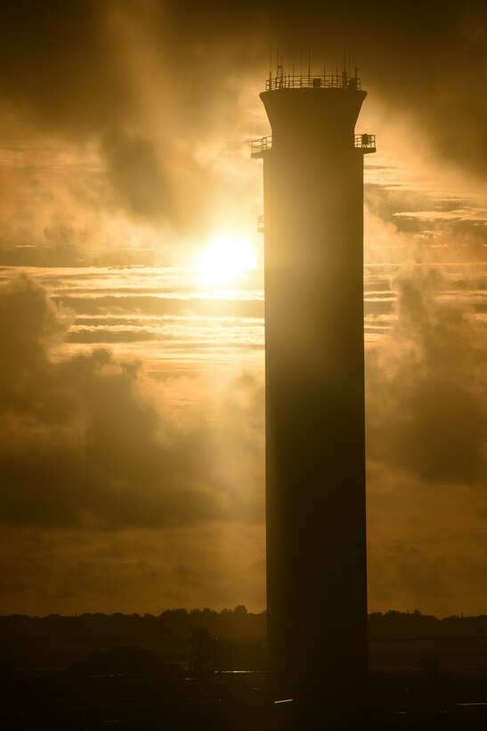 The sun sets behind the air traffic control tower, Sept. 19, 2019, Andersen Air Force Base, Guam.